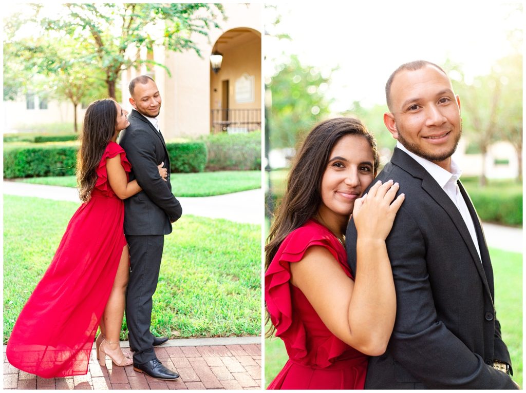 Engaged couple getting engagement photos done in red dress and black suit in central florida