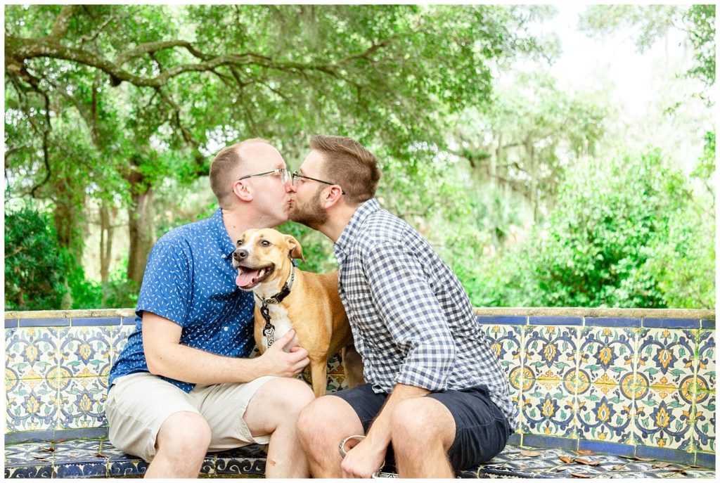 Engaged couple shares kiss at their photo session in Florida. 
